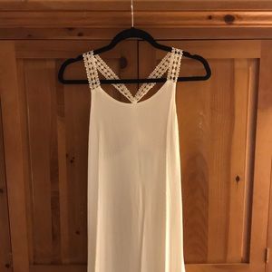 White dress with asymmetrical lacy hem
